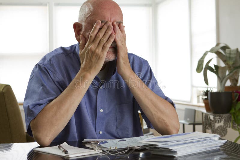 Older man paying bills royalty free stock photo Older man paying bills royalty free stock photo