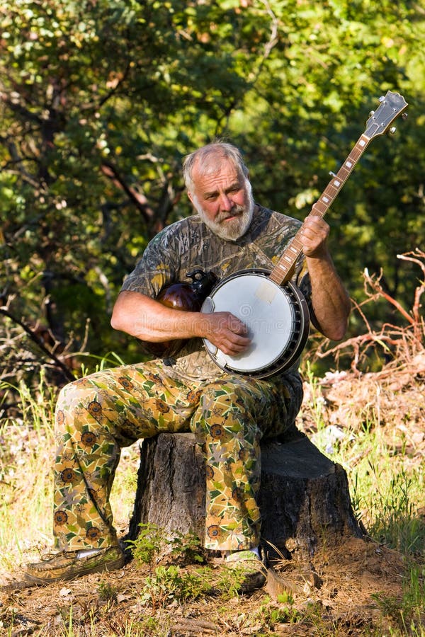 Older Man Playing the Banjo Outdoors