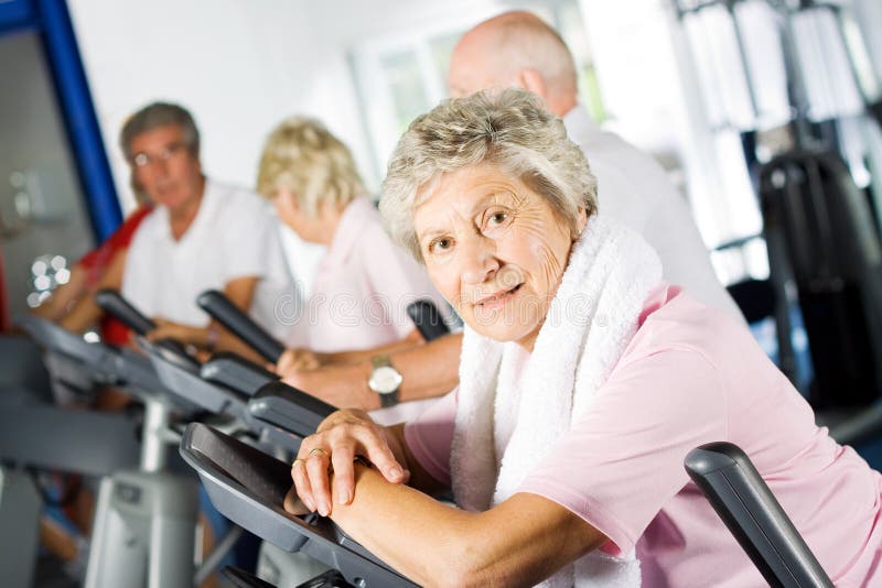 Group of older mature people exercising in the gym. Group of older mature people exercising in the gym