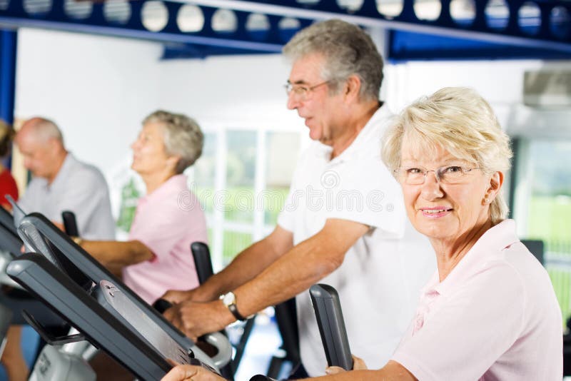 Group of older mature people exercising in the gym. Group of older mature people exercising in the gym