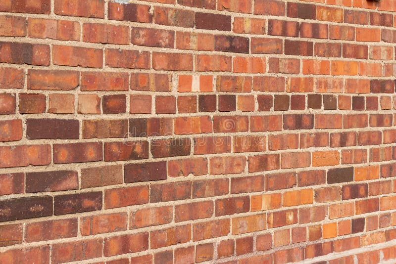 Older Red Clay Brick Wall Background With Grungy Texture Stock Photo