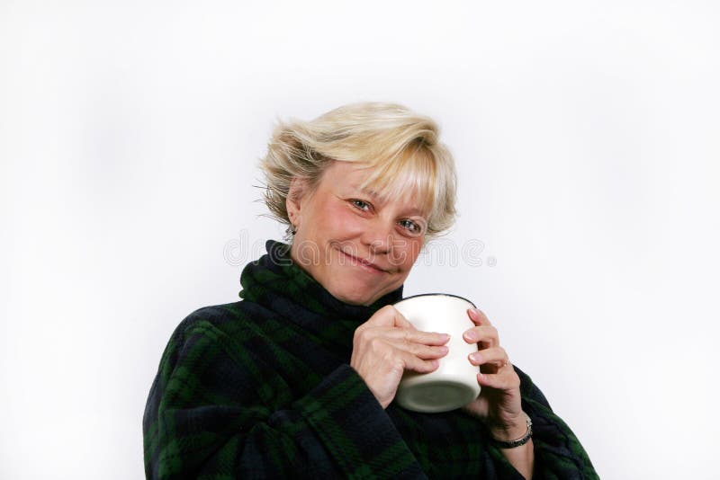 Mature caucasian woman holding coffee cup. Mature caucasian woman holding coffee cup