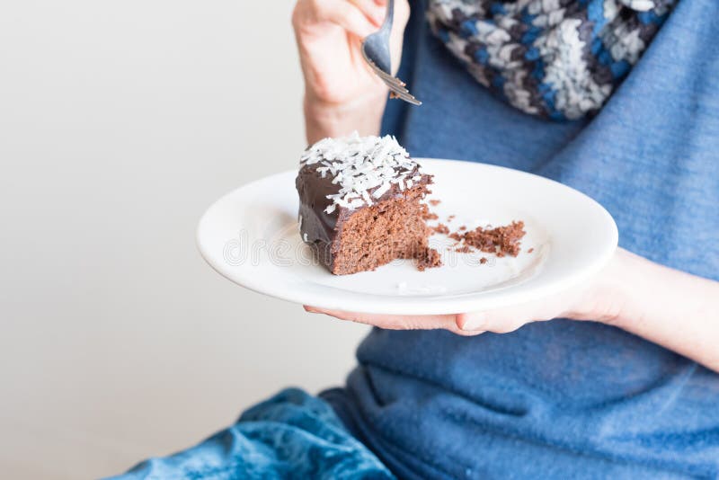 Older woman holding plate with chocolate cake royalty free stock photos Older woman holding plate with chocolate cake royalty free stock photos
