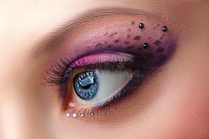 Closeup female eye with beautiful fashion bright makeup. Closeup female eye with beautiful fashion bright makeup