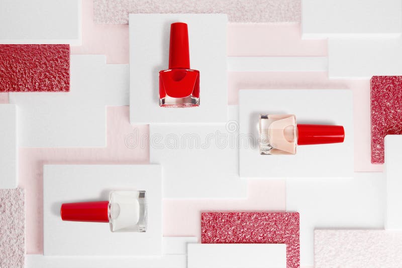 Top view of various nail polish bottles on cubes, 3d rendering background. Cosmetics concept. Top view of various nail polish bottles on cubes, 3d rendering background. Cosmetics concept