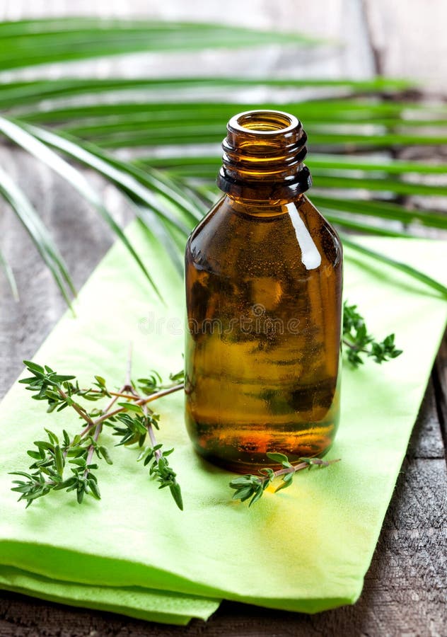 Fresh ethereal thyme oil in bottle. Fresh ethereal thyme oil in bottle