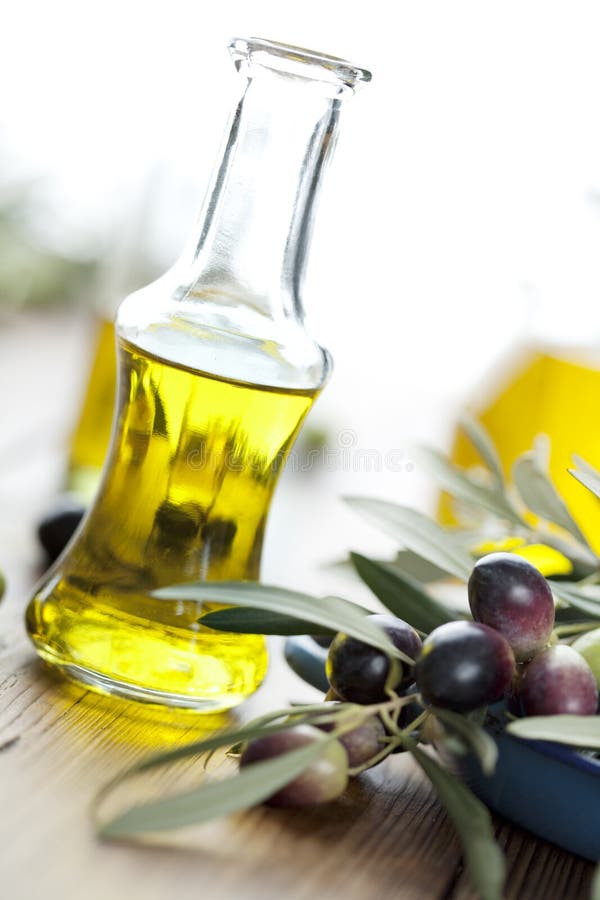 Olive oil on wooden table. Olive oil on wooden table