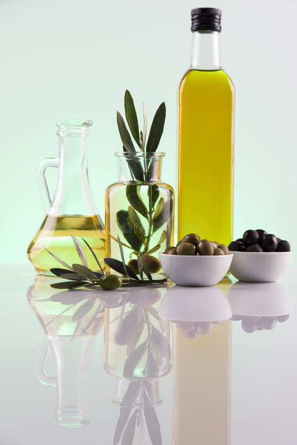 Bottles with Organic Cooking Olive Oil and Olive Branch Stock Photo ...