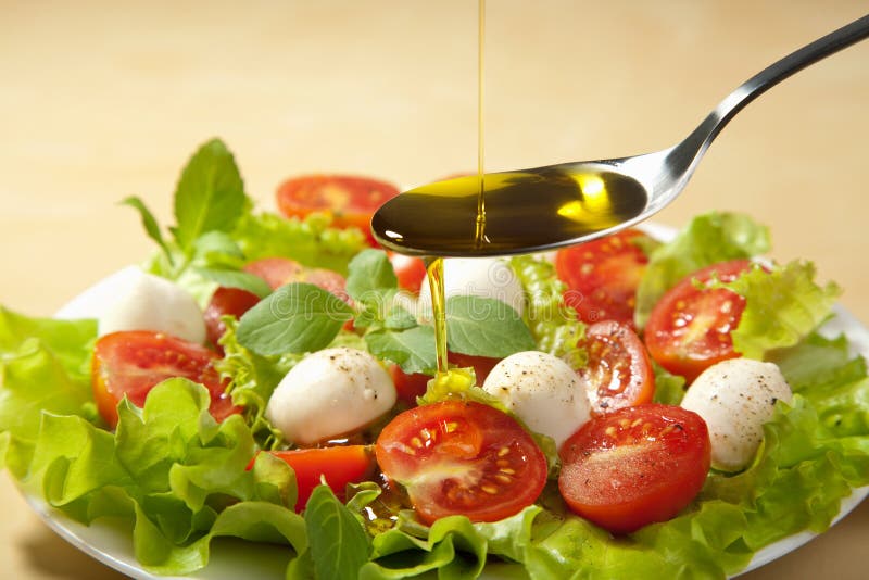 Olive Oil Pouring Over Salad Stock Image Image of colored, leaf 13937783