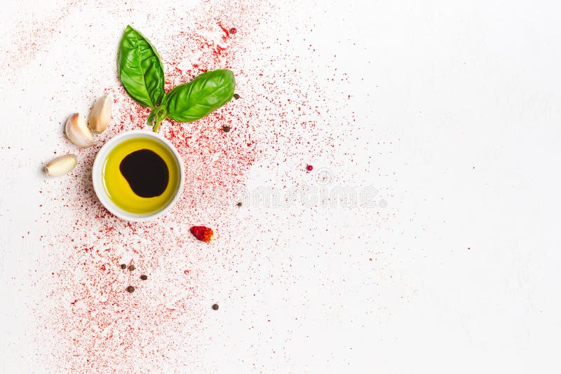 Olive oil and sprig of basil on a white background. Balsamic, leaves.