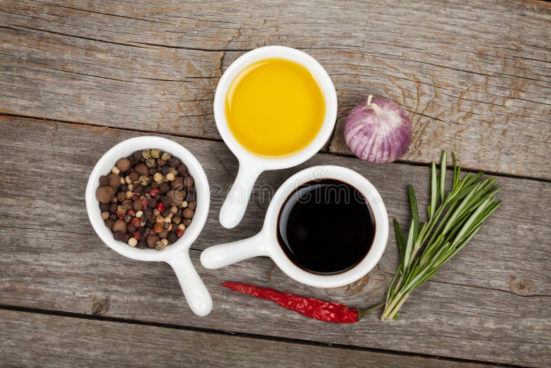 Olive oil and vinegar with spices royalty free stock photography