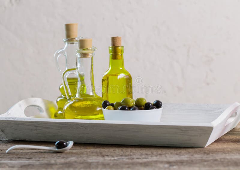 Olive oil on wooden table stock image. Image of fresh 99949259