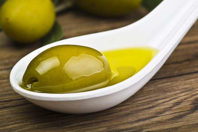 Olive on the spoon stock photo. Image of green, snack 19968476