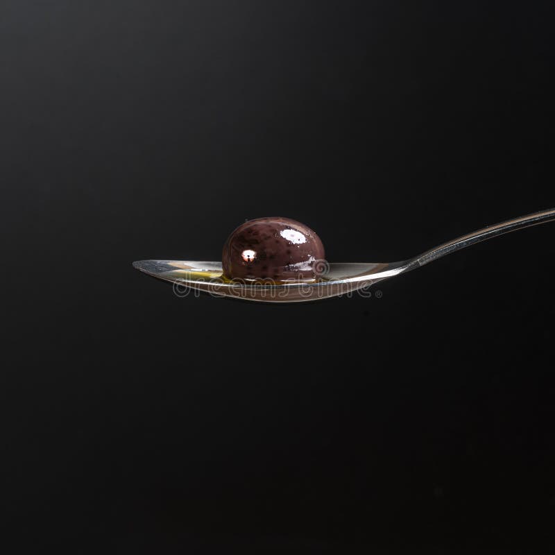 Olive oil on a spoon stock photo. Image of white, steel 16155742