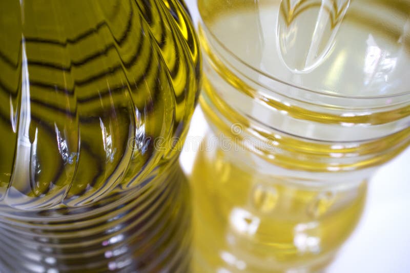 Olive Versus Sunflower Oil Bottled. Upper View with Young Olives Stock