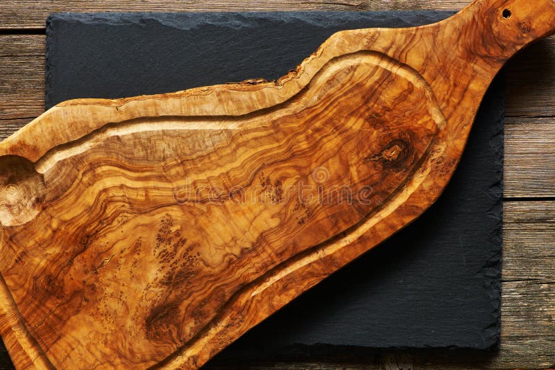 Olive wood cutting board stock photo. Image of dried 61925496