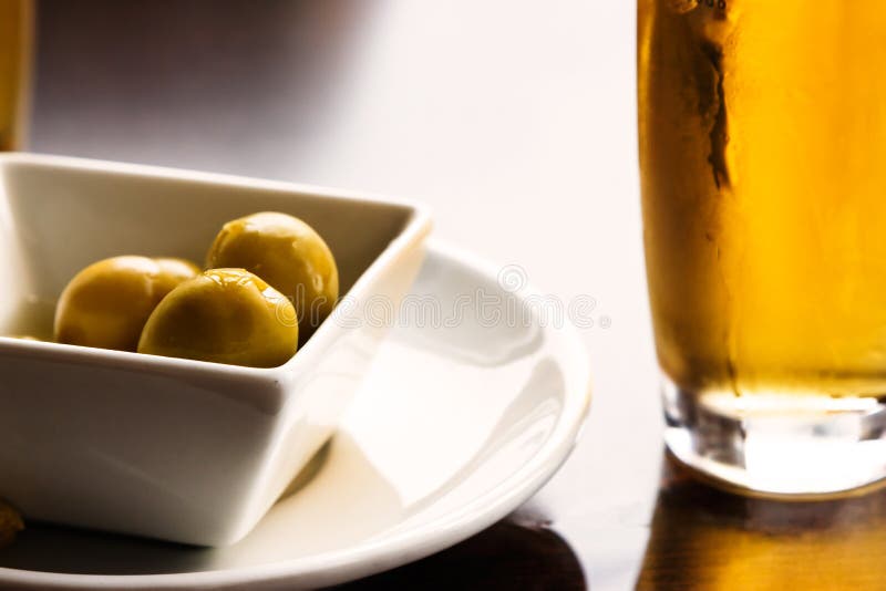 Olives and beer. stock image. Image of meal, healthy 82330835