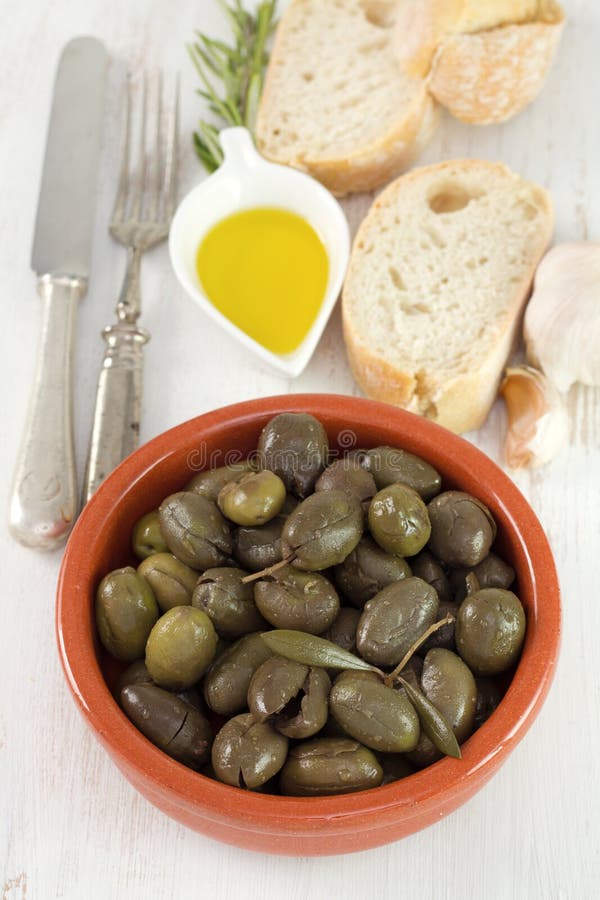 Olives in Brown Ceramic Bowl with Olive Oil Stock Image Image of