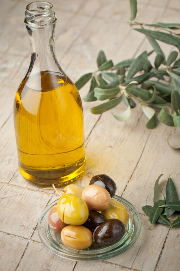 Bottle with Oil and Olives, Extra Virgin Olive Oil. Useful Oil for