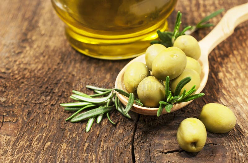 Olives with rosemary and olive oil stock photo Olives with rosemary and olive oil stock photo