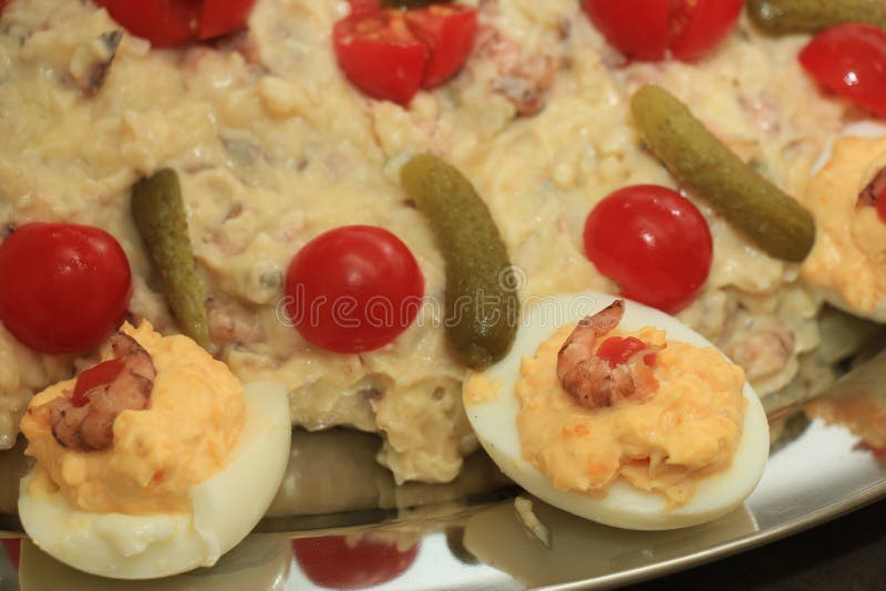 Olivier scrimp salad with pickles, tomatoes and eggs. Olivier scrimp salad with pickles, tomatoes and eggs