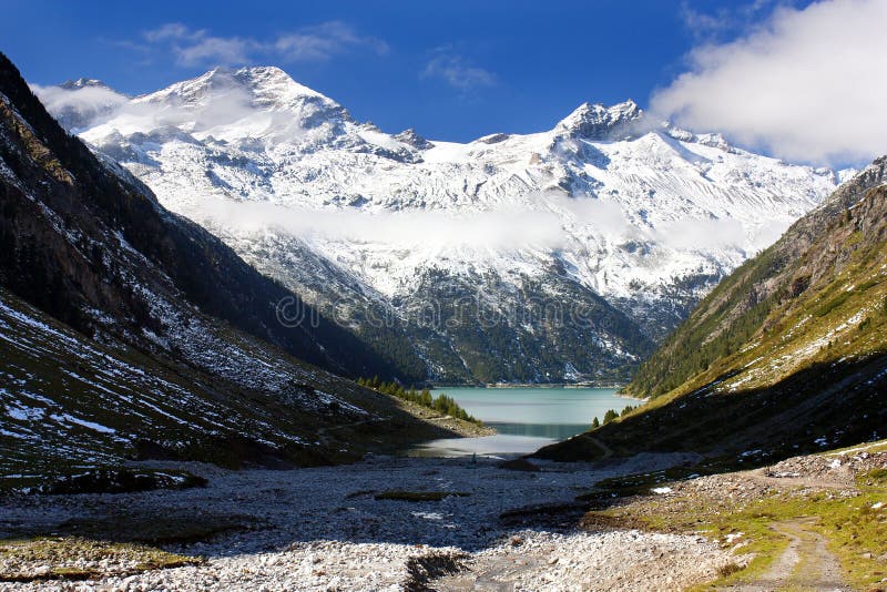 Olperer above Schlegeisspeicher lake royalty free stock photos