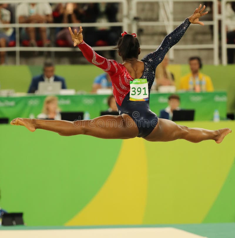 Olympic champion Simone Biles of USA competes on the floor exercise during women's all-around gymnastics qualification