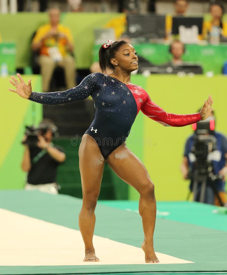 Olympic champion Simone Biles of USA competes on the floor exercise during women's all-around gymnastics qualification