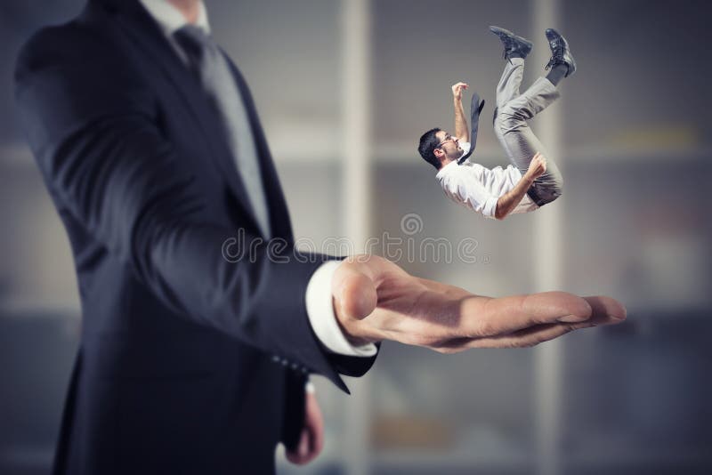 Om de afaceri este salvat de la o mână mare. conceptul de sprijin pentru întreprinderi și asistență royalty free stock photo