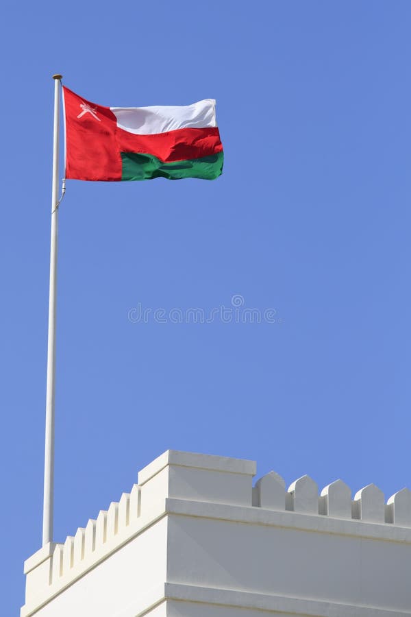 Oman flag and battlements royalty free stock photos