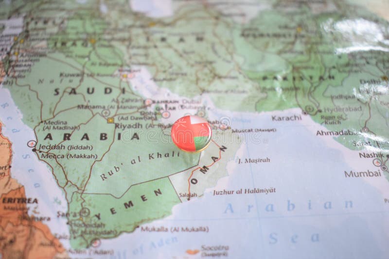 Oman flag drawing pin on the map stock photo