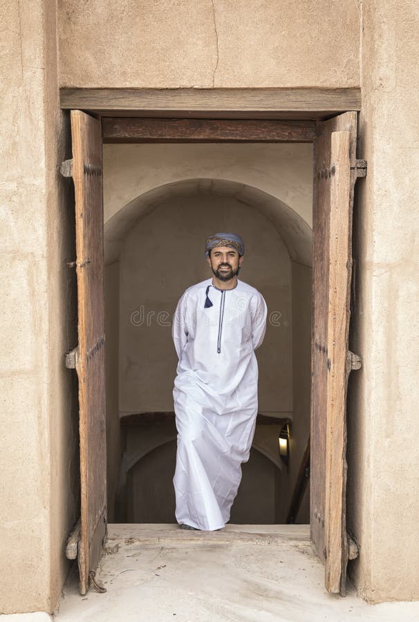 Arab man in traditional omani outfit in an old castle