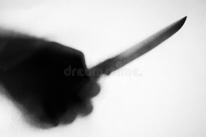 Ombra del coltello della tenuta della mano immagini stock Ombra del coltello della tenuta della mano immagini stock