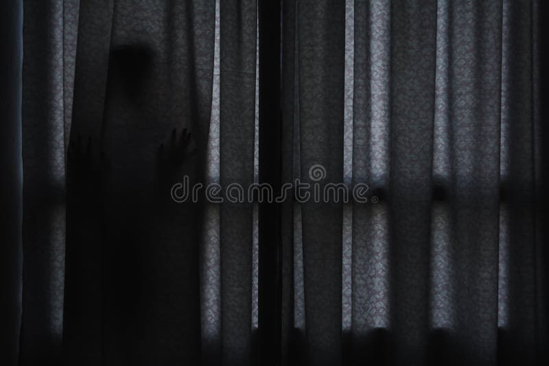 Horror scene of woman`s shadow standing hiding behind curtain. Horror scene of woman`s shadow standing hiding behind curtain