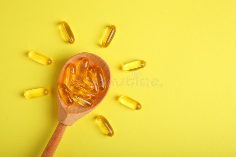 Omega 3 capsules on a colored background close-up with place for text.