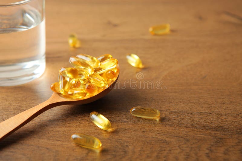 Omega 3 capsules on the table close-up with place for text.