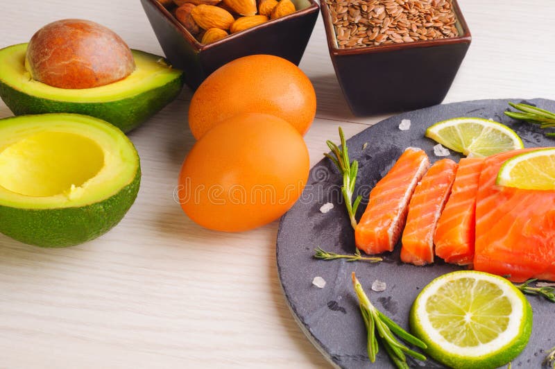 Omega 3 Sources Fish, Avocado, Nuts, Linen Seeds, Egg Stock Photo