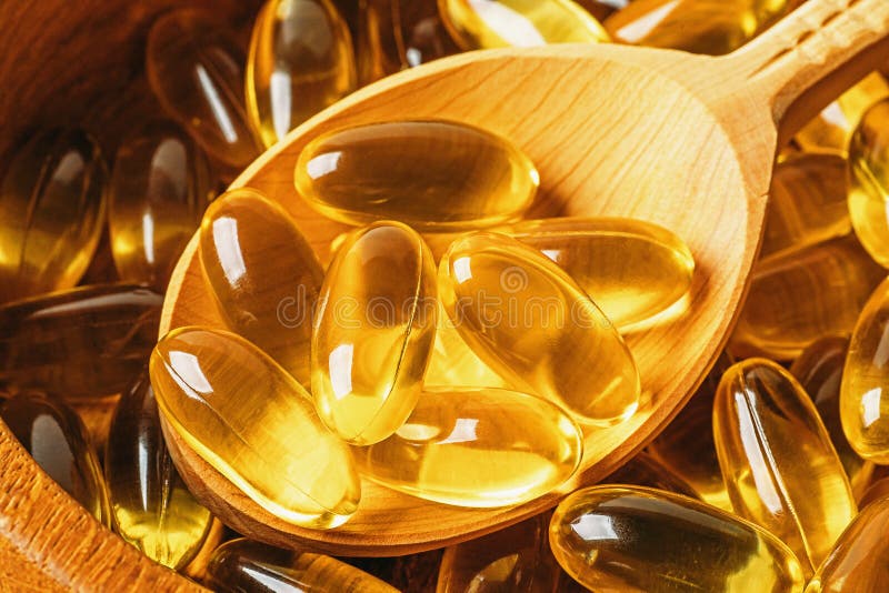 Omega 3 vitaminengel capsules in houten lepel, gezond en voedingspatroon, macrofotoclose-up stock foto Omega 3 vitaminengel capsules in houten lepel, gezond en voedingspatroon, macrofotoclose-up stock foto