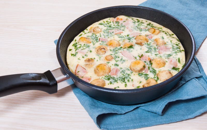 Omelet with Mushrooms, Ham and Cheese in a Pan Stock Photo Image of