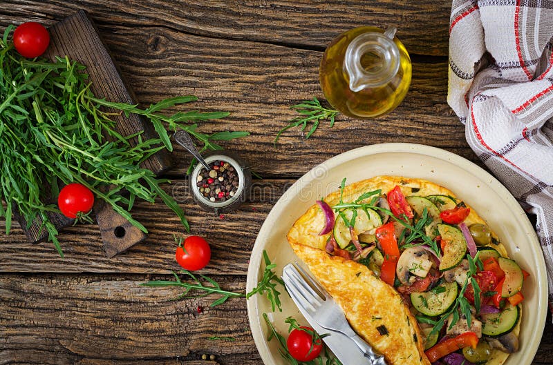 Omelet with tomatoes, zucchini and mushrooms. Omelette breakfast. stock photo Omelet with tomatoes, zucchini and mushrooms. Omelette breakfast. stock photo
