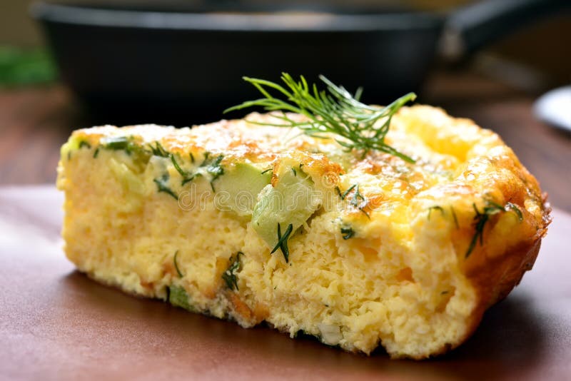 Omelette with herbs, cheese and zucchini royalty free stock photo