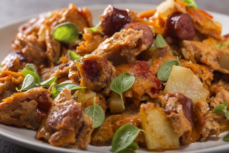 Omelette Made from Eggs, Potatoes, Sausages and Tomato Sauce Stock