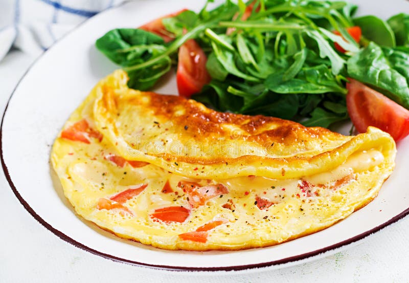 Omelette with Tomatoes and Salad on White Plate. Frittata - Italian ...