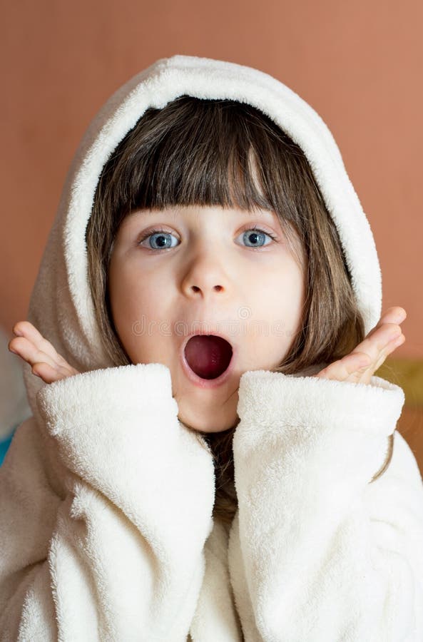 OMG!Surprised kid wearing bathrobe after bath or shower. Bathing and washing of children royalty free stock image OMG!Surprised kid wearing bathrobe after bath or shower. Bathing and washing of children royalty free stock image