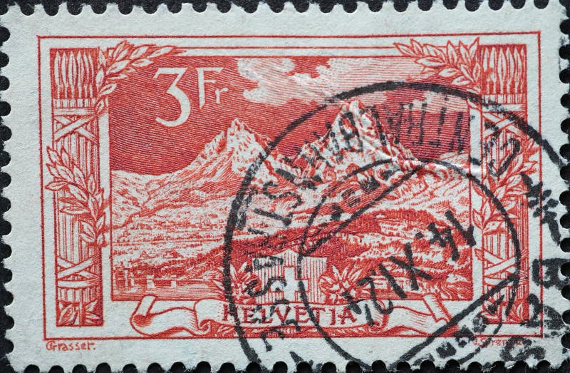 Switzerland - Circa 1915 : a postage stamp printed in the Switzerland showing a landscape with mountains and myths in the foreground. redbrown . Switzerland - Circa 1915 : a postage stamp printed in the Switzerland showing a landscape with mountains and myths in the foreground. redbrown .
