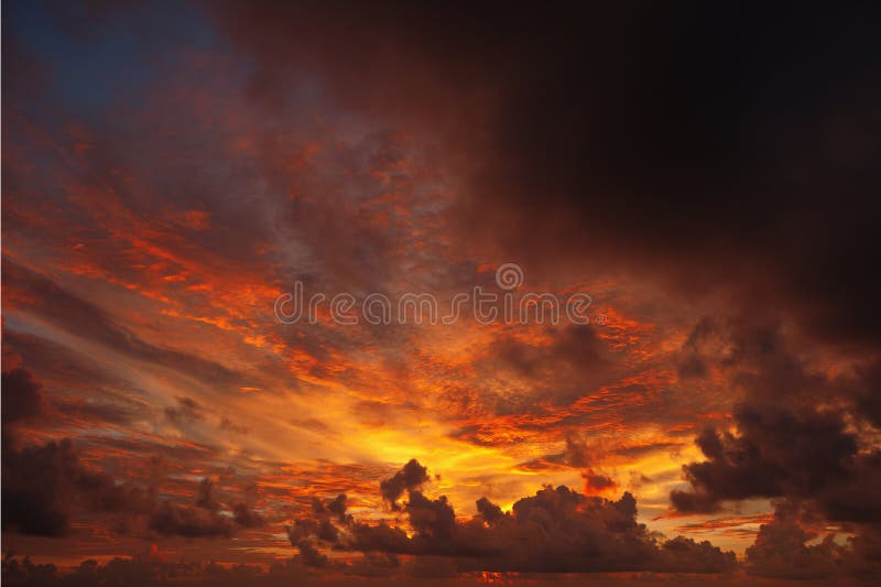 Ominous sunset , the sun paints the clouds red