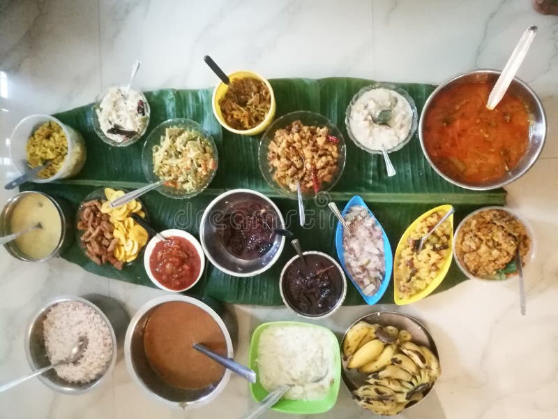 Onam special meals made with vegetables in separate vessels in an array. stock photography