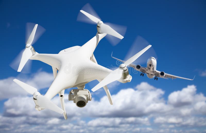 Unmanned Aircraft System UAV Quadcopter Drone In The Air Too Close To Passenger Airplane. Unmanned Aircraft System UAV Quadcopter Drone In The Air Too Close To Passenger Airplane.