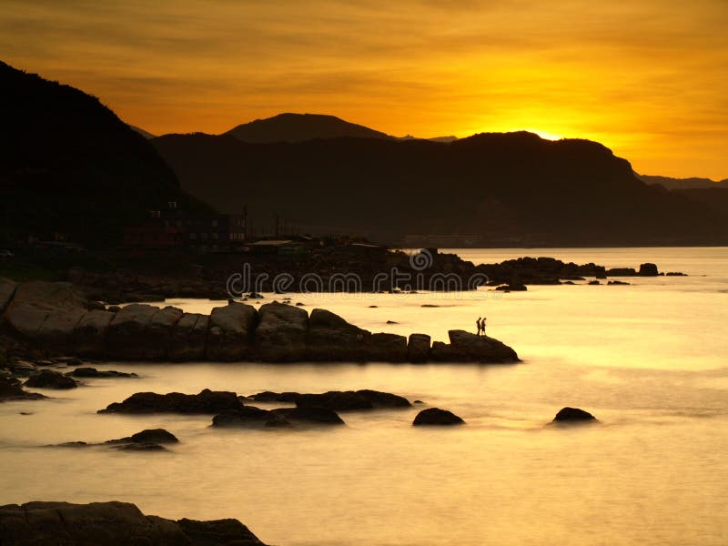 It is Keelung City which is in northern Taiwan. The sea is just like a cotton candy. I just wanted to take the photo of golden sunshine. It is Keelung City which is in northern Taiwan. The sea is just like a cotton candy. I just wanted to take the photo of golden sunshine.