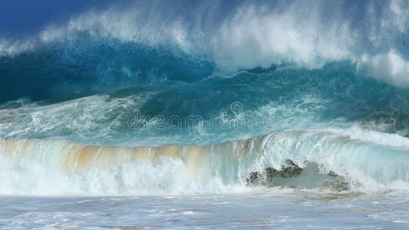 Huge double up set wave pounds the shore at Sandy beach during a big summer south swell on Oahu. Huge double up set wave pounds the shore at Sandy beach during a big summer south swell on Oahu.